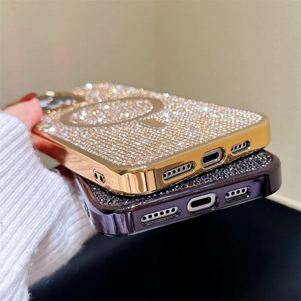 a woman holding a gold and silver iphone case