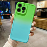 a woman holding a green and blue iphone case
