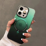 a woman holding a green iphone case