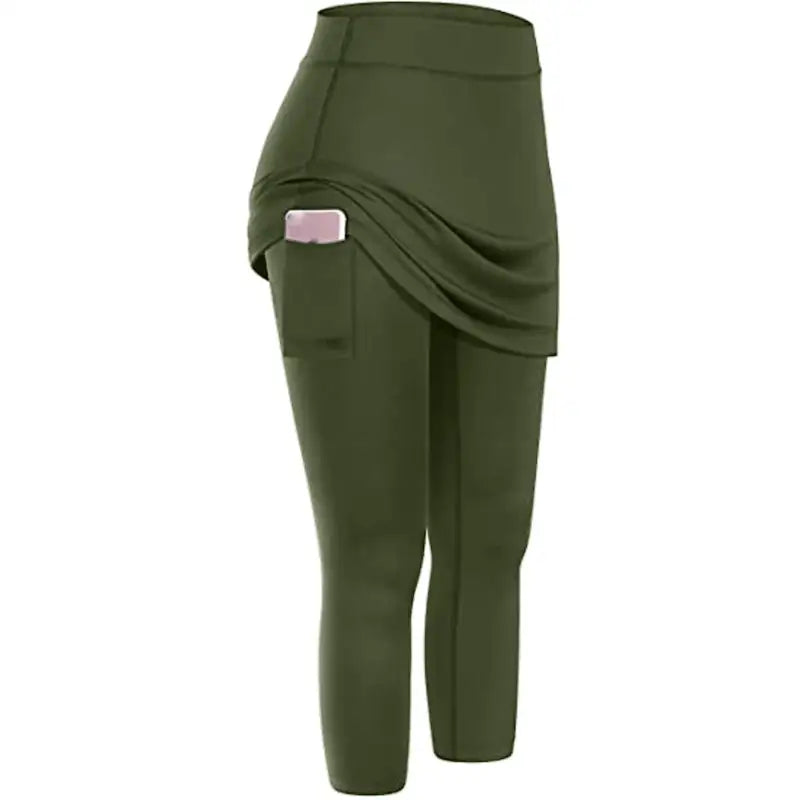 a woman wearing a green pants with a pink waistband