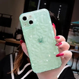 A woman holding a green phone case