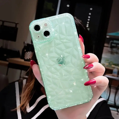 A woman holding a green phone case