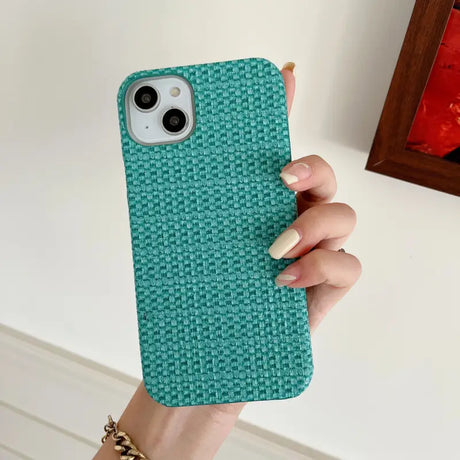 A woman holding a green phone case