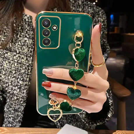 a woman holding a green phone case with a ring