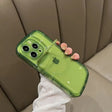 A woman holding a green phone case