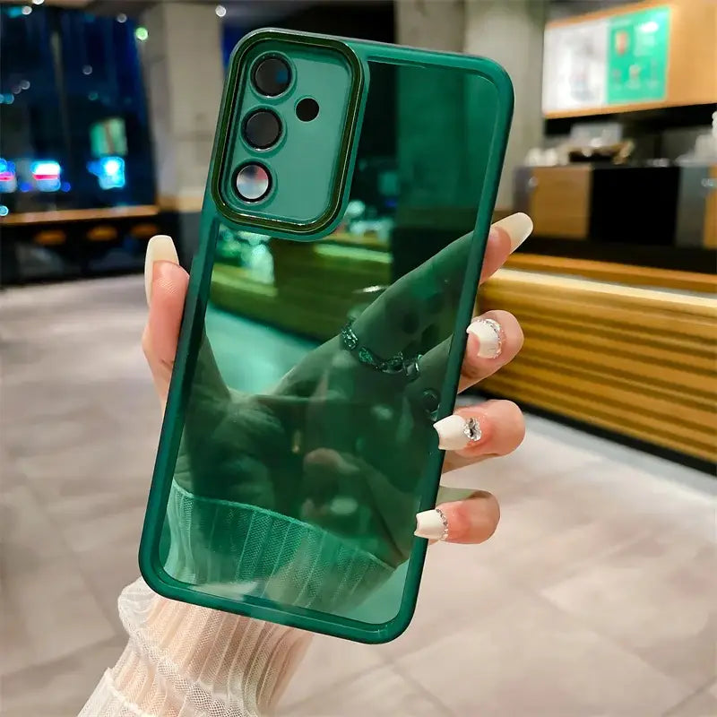 a woman holding a green phone case with a shark on it