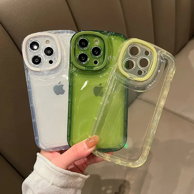 a woman holding a green and white iphone case