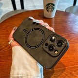 a woman holding a black phone case with a camera inside