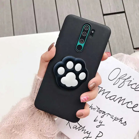 a woman holding a black phone case with a mickey mouse mouse