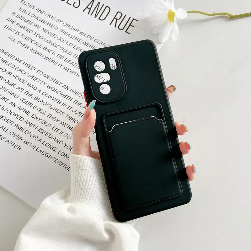 the black leather case is held up against the white background