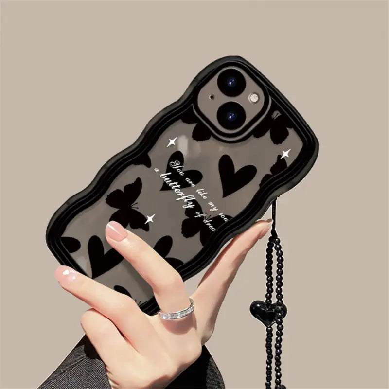 a black phone case with a heart design