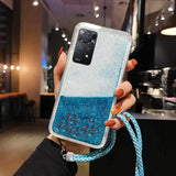 a woman holding a blue glitter phone case