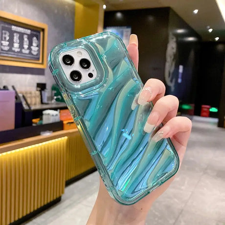 a hand holding a blue iphone case