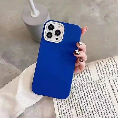 a woman holding a blue iphone case