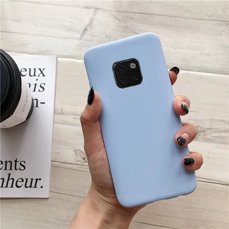 a woman holding a blue phone case