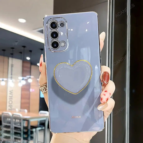 a woman holding a phone case with a heart