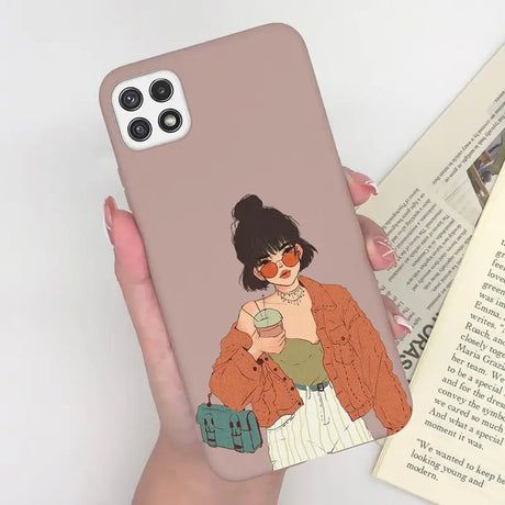 a woman holding a book and a phone case