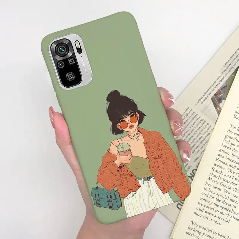 a woman holding a book and a phone case