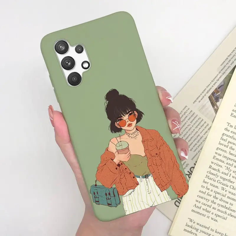 a woman holding a book and a phone case