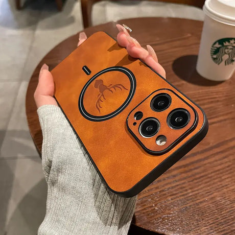 a woman holding a brown leather case with a camera lens