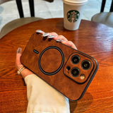 a woman holding a brown leather case with a camera inside