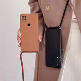 a woman holding a brown phone case