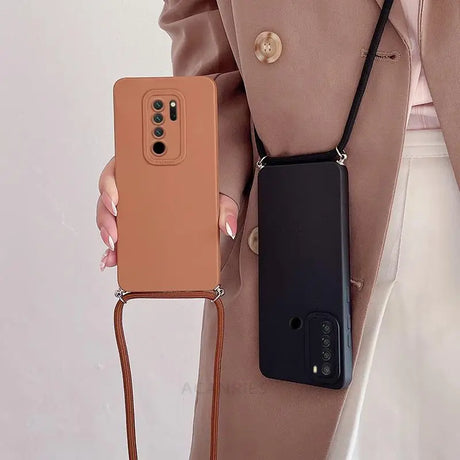 a woman holding a brown phone case