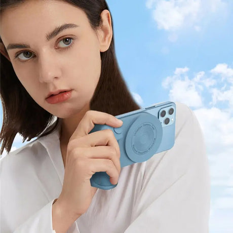 a woman holding a camera in her hand