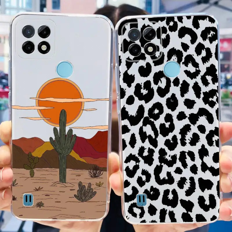 a person holding up a phone case with a desert scene