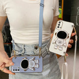 a woman holding a cell phone case with a camera