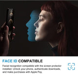a woman holding a cell phone with a face on it