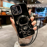 a woman holding a phone case with a camera attached to it