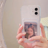 a woman holding a cell phone with a picture of her