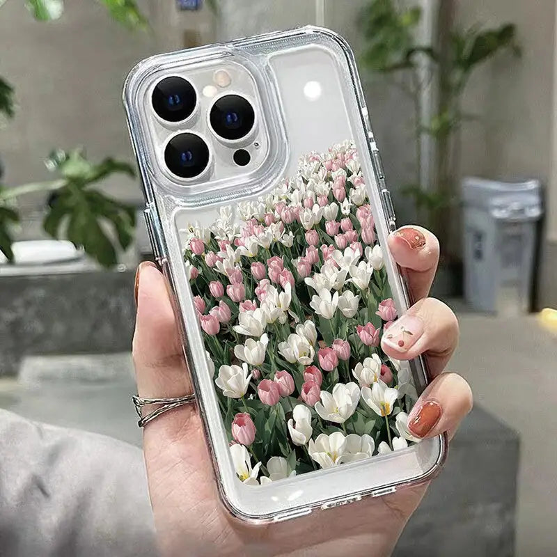 a woman holding a clear case with flowers in it