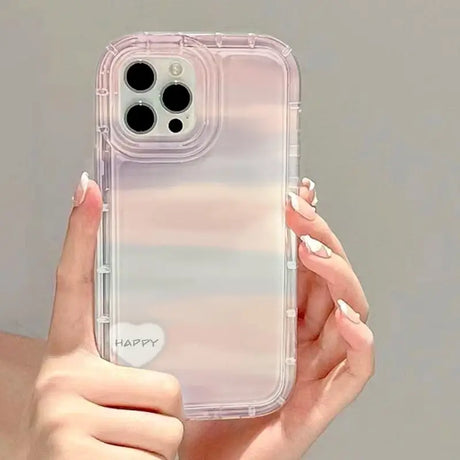 a woman holding a clear phone case