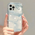 a woman holding a clear phone case with a white marble pattern