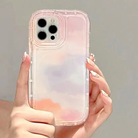 a woman holding a clear phone case