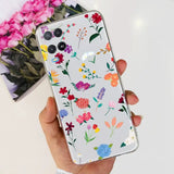 a woman holding a phone case with flowers on it