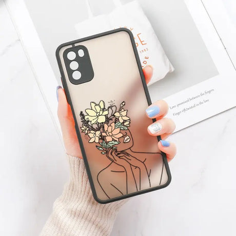 a woman holding a phone case with flowers on it