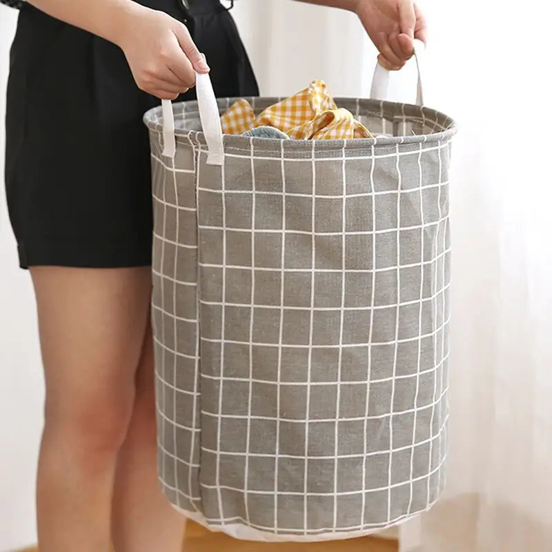 a woman holding a gray and white bag