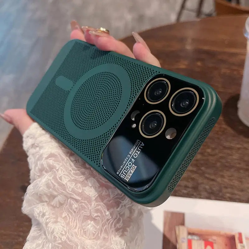 a woman holding a green phone case with a camera