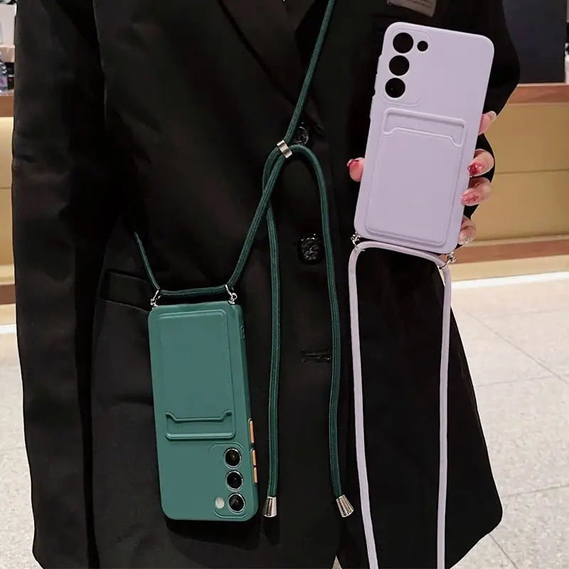 a woman holding a green and white phone case