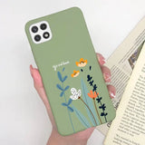 a woman holding a phone case with flowers on it