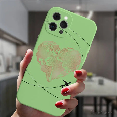 a woman holding a green phone case with a world map on it