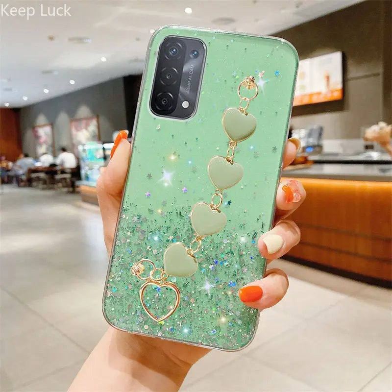 a green phone case with heart charms
