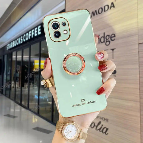 a woman holding a phone case with a watch on it