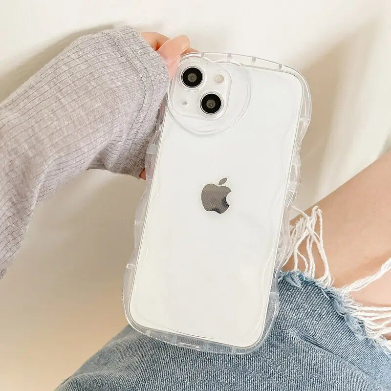 a woman holding an iphone case with a white phone