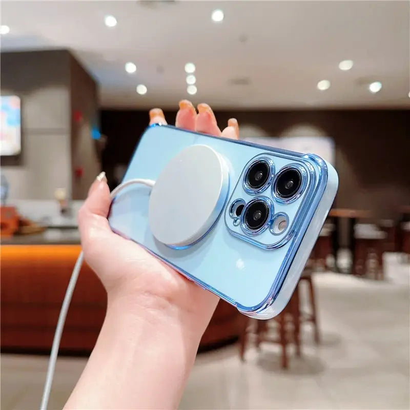 a hand holding a blue iphone case with a camera attached to it