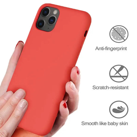 a woman holding a red iphone case