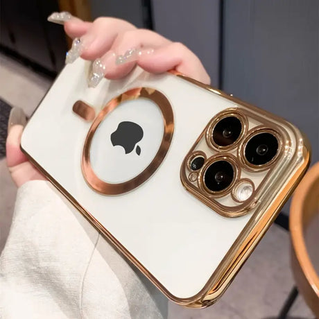 a woman holding a gold iphone case